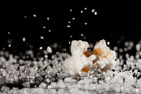 Closeup of a delicious popcorn on a layer of salt