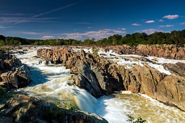 rushing rapids of the Potomac river in summer in Great Falls National Park in Maryland and Virginia.