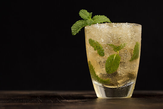 Closeup of a mojito with lots of ice on a table