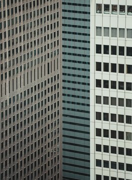 View to high skyscrapers towers and small buildings in big city