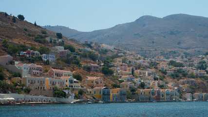 View of Symi island beach and village from the sea. Dodecanese, Greece