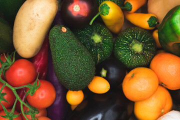 closeup of many fresh organic vegetables of various colors 
