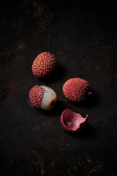 Top view of lychee on dark rustic wooden background