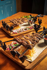 lamb kebab with sause and vegetables