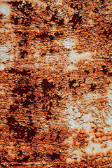 Painted old grunge textured metal sheet surface with traces of strong and heavy rust. Top view, vertical orientation. Flat lay