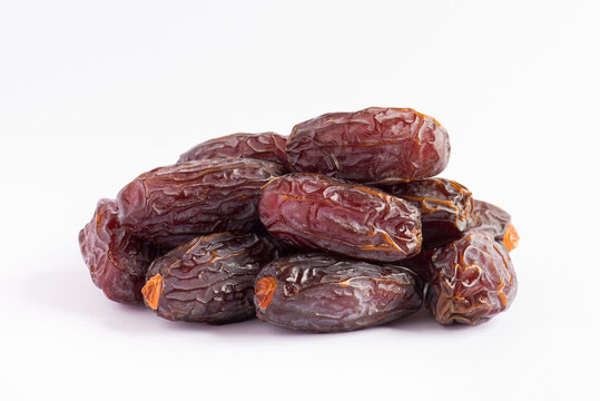 HURMA, Dates. Dried dates fruit on white background. Popular fruit of Ramadan.