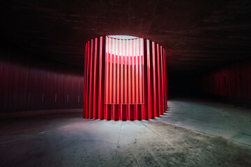 Bright round shaped geometric wall in theater with concrete floor