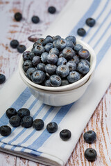 Freshly picked organic blueberries. Rustic style syill life. Healthy eating and nutrition.