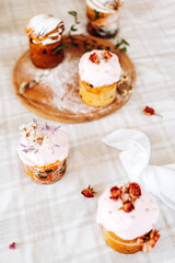 Easter. Homemade baking Easter cakes decorated with dried flowers on the table