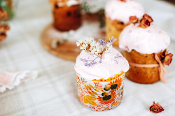 Easter. Homemade baking Easter cakes decorated with dried flowers on the table