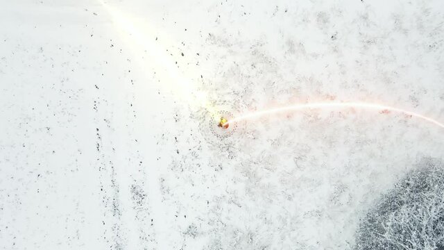 Electrician works with modern equipment on broken line in a snow storm. Snowstorm, Electricity Engineer. Digital overlay light rays.