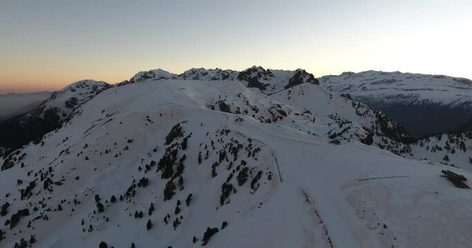 Summit of the French Alps at Chamrousse during early sunrise, Aerial flyover shot