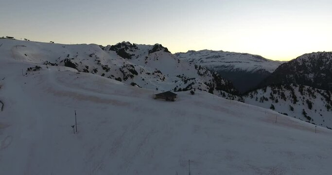 Chamrousse mountains summit on the French Alps with shelter cabin, Aerial flyover approach shot