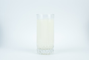 A glass of milk on the white background
