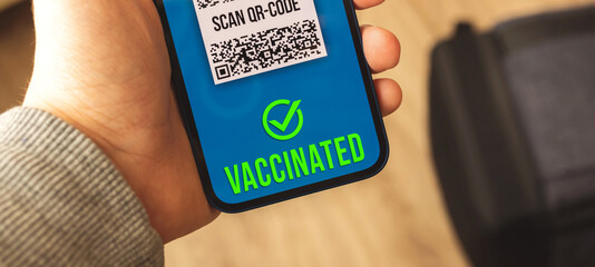 Health passport with valid result of COVID-19 testing, vaccinated person in airport