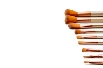A set of makeup brushes. Selective focus, white background, isolate.