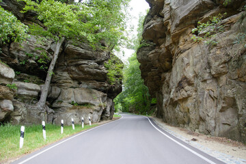 Road between rock formations in Luxembourg country