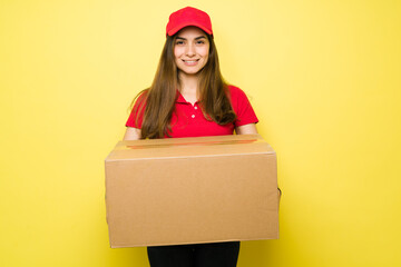 Hispanic woman smiling while making a delivery