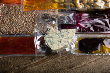 Different products and sauces in vacuum sealed plastic packaging