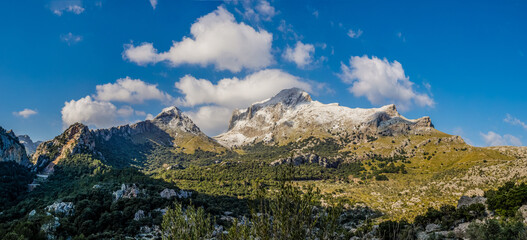 mountains with snow  and clouds in the tramuntana area on the balearic island of mallorca, spain