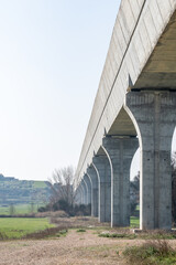 Bottom view of a modern aqueduct with its pillars.