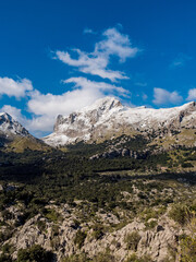 Fototapeta na wymiar mountains with snow and clouds in the tramuntana area on the balearic island of mallorca, spain