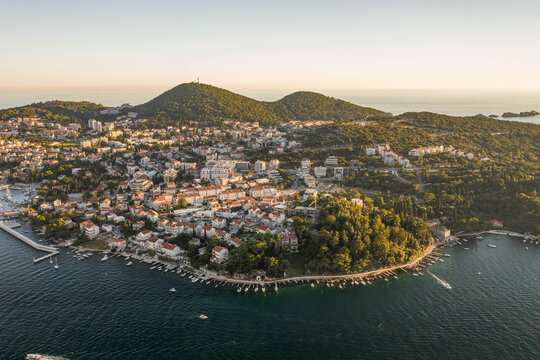 Aerial drone shot of Babin Kuk residential hill area in Dubrovnik in Adriatic sea in Croatia summer sunset