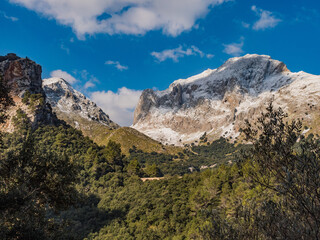 Fototapeta na wymiar mountains with snow and clouds in the tramuntana area on the balearic island of mallorca, spain