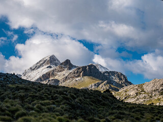 Fototapeta premium mountains with snow and clouds in the tramuntana area on the balearic island of mallorca, spain