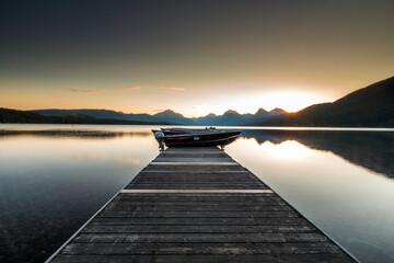 dramatic, peaceful and  serene summer  sunset photo of Lake McDonald in Glacier National Park in. Montana.
