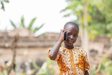 african kid making a phone call
