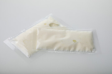 White cream in vacuum sealed plastic bag