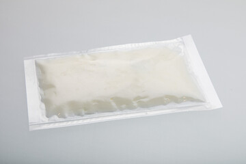 White cream in vacuum sealed plastic bag