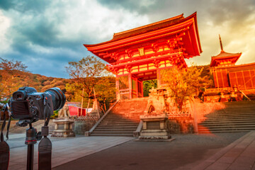 Kyoto, Japan - April 24, 2017:Close up of Canon camera on tripod photographing the scenic Kiyomizu-dera Temple Gate with sunset light. Kiyomizu is the most celebrated temples of Japan. Unesco Heritage