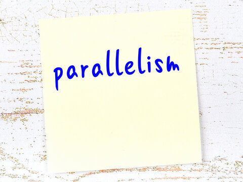 Yellow sheet of paper with word parallelism. Reminder concept