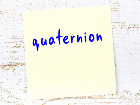 Yellow sheet of paper with word quaternion. Reminder concept