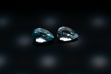 Natural stone blue topaz on a black background