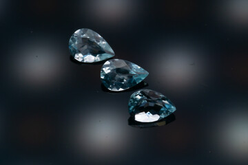 Natural stone blue topaz on a black background