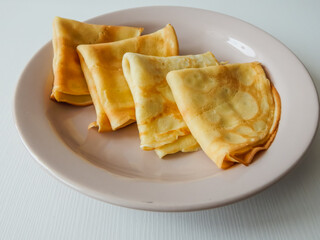 pancakes stacked on a plate, carnival