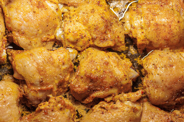 Baked pieces of chicken meat in its own juice. Top view