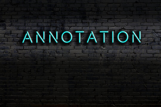Neon sign. Word annotation against brick wall. Night view