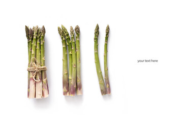 group of raw asparagus on white background as layout. space for your text