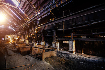 Old rusty abandoned metallurgical plant. Ruined blast furnace