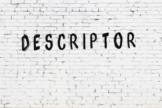 White wall with black paint inscription descriptor on it