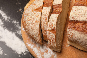 Fresh bread on a wooden board. Homemade baking.