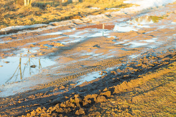 Country dirt road in the spring. Dirt on the road during the thaw.