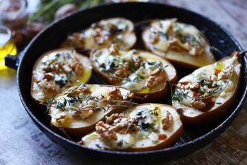 Baked pears with cheese and nuts in a frying pan. Keto is friendly.