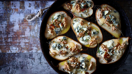 Baked pears with cheese and nuts in a frying pan. Keto is friendly.