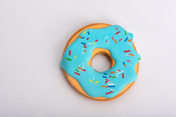 Creative pattern of colorful donuts on pastel blue background. Minimal food concept. Isometric.