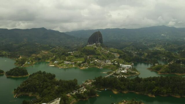Wide Angle View of Guatape Rock on Cloudy Day. Birds Eye View Above Guatape Lake